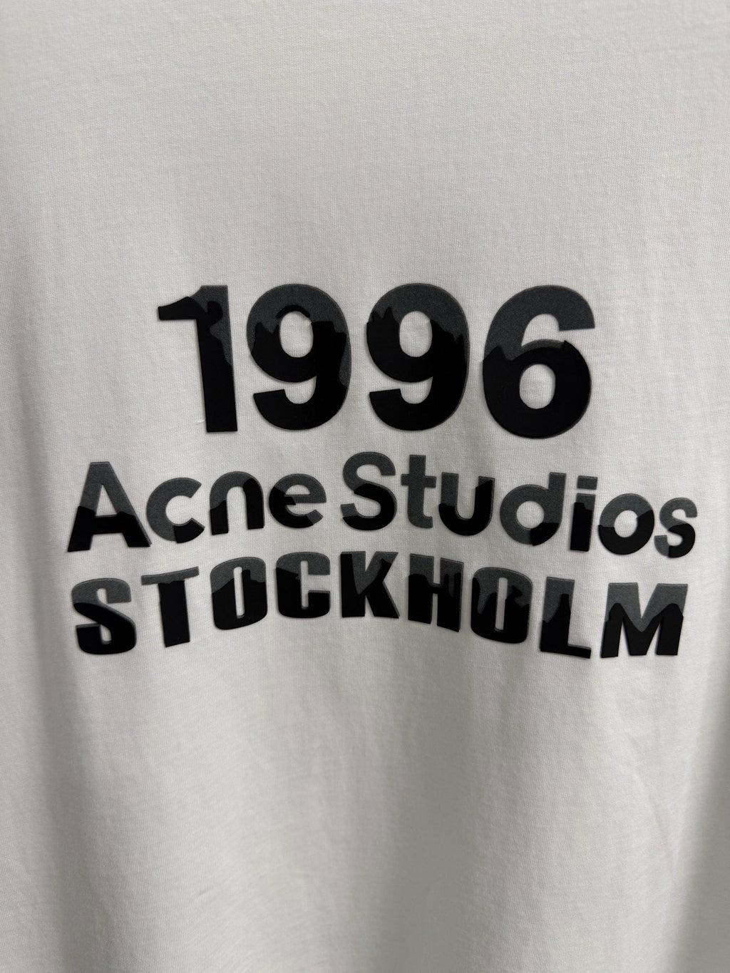 Acne Studios Stockholm 1996 Stacked‑Text Distressed‑Hem Oversized Crew‑Neck T‑Shirt