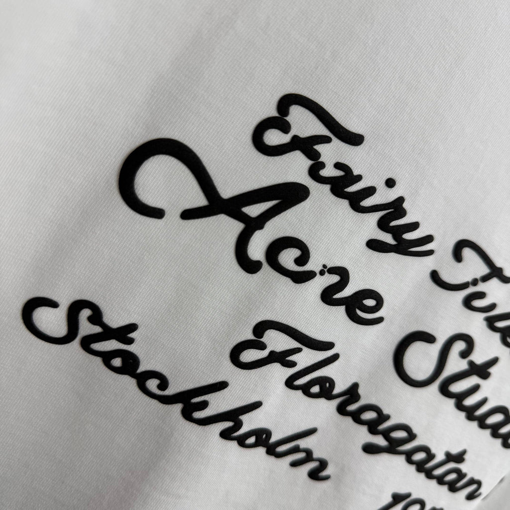 Acne Studios Fairy‑Tales Cursive‑Text Distressed‑Trim Crew‑Neck Short‑Sleeve T‑Shirt